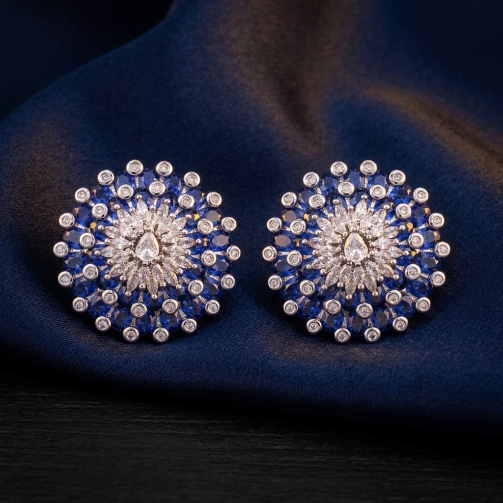 Mataari Earrings Silver Moissanite Crystal Flower Clip On Stud Earrings with Emerald & Blue Sapphire Accents